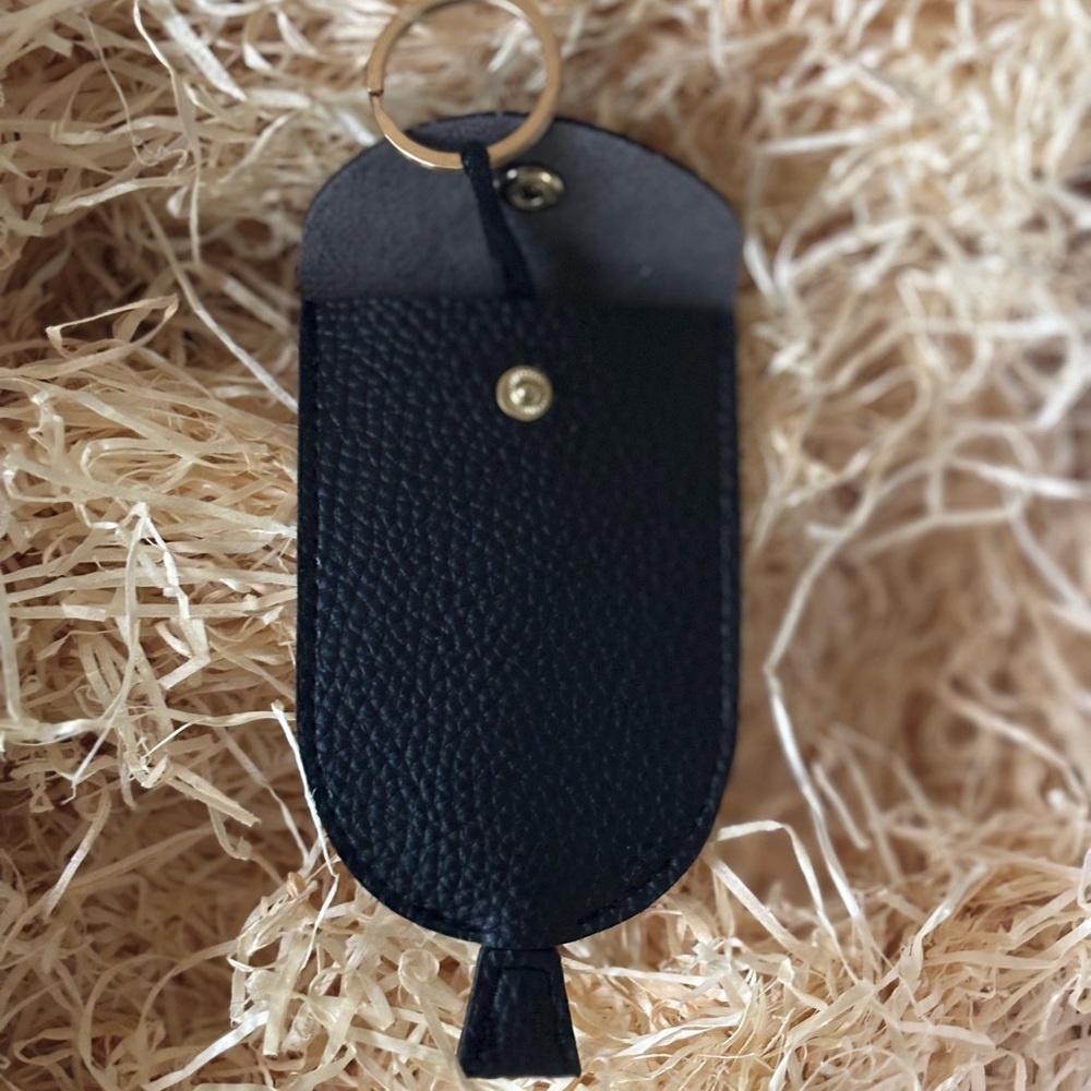 Black Pebbled faux leather Key Holder with Gold Snap Button and key ring.